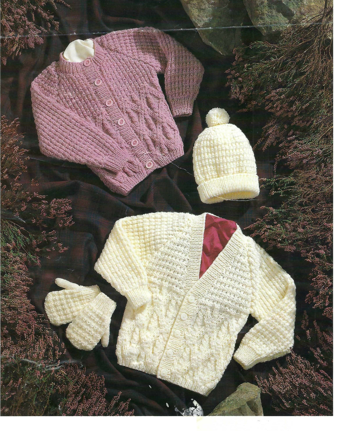 round- and V-neck Aran cardigans, plus a hat and mittens. It covers chest sizes 16–30 inches and uses 4 mm and 5 mm needles.round- and V-neck Aran cardigans, plus a hat and mittens. It covers chest sizes 16–30 inches and uses 4 mm and 5 mm needles.